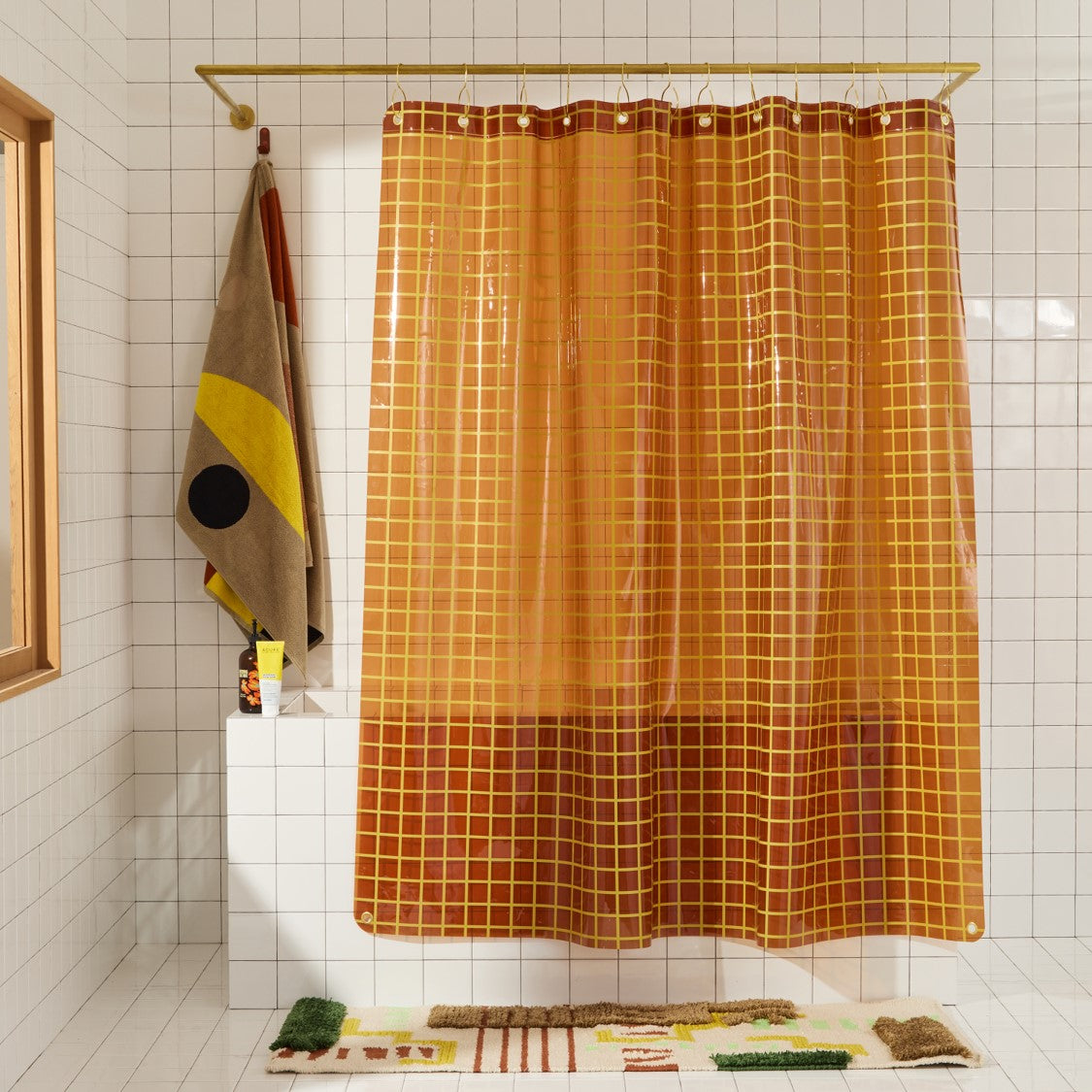 Sun Shower in Honey 2x2 front view of curtain hanging in a bathroom.