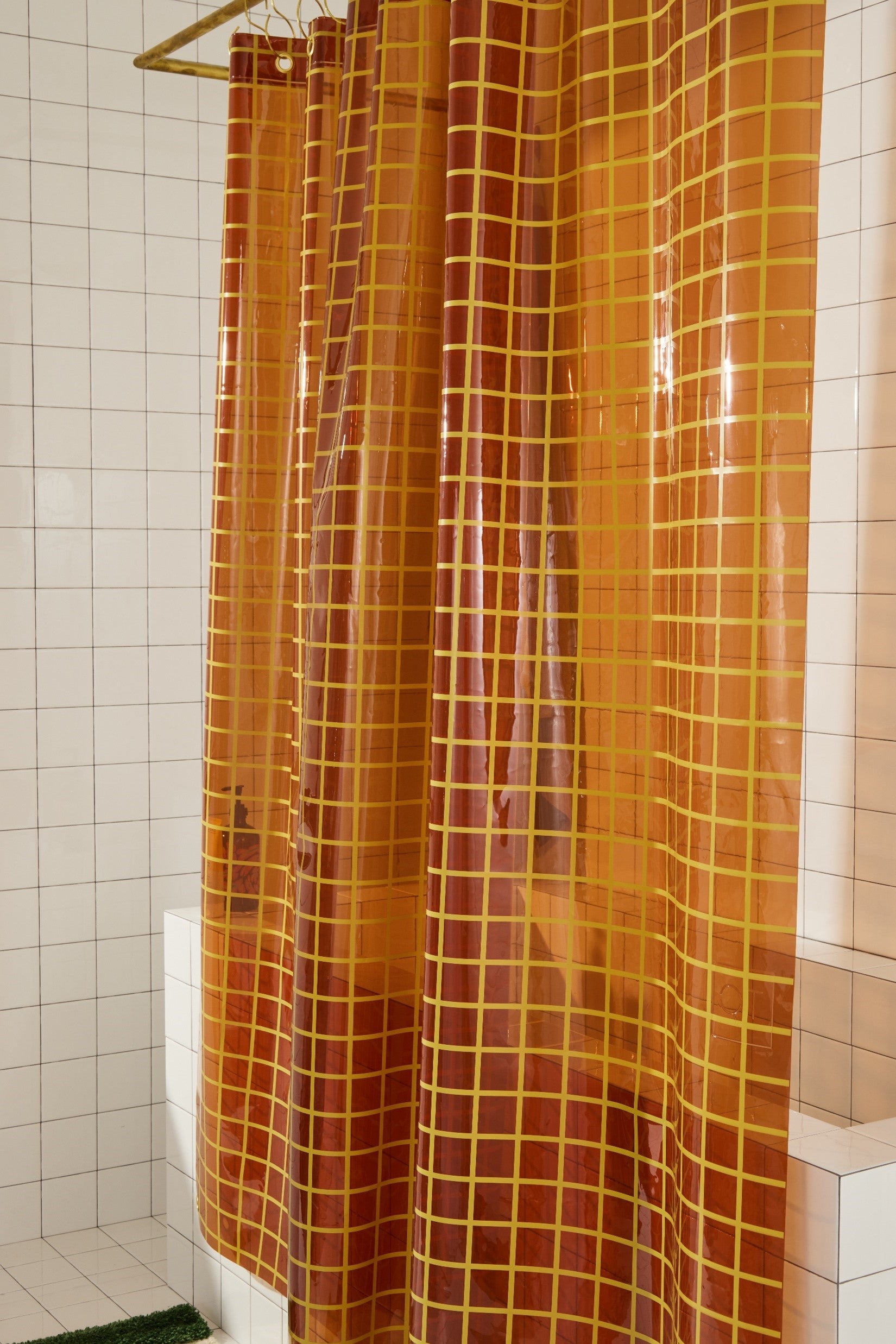 Sun Shower in Honey 2x2 side view of curtain hanging in a bathroom.