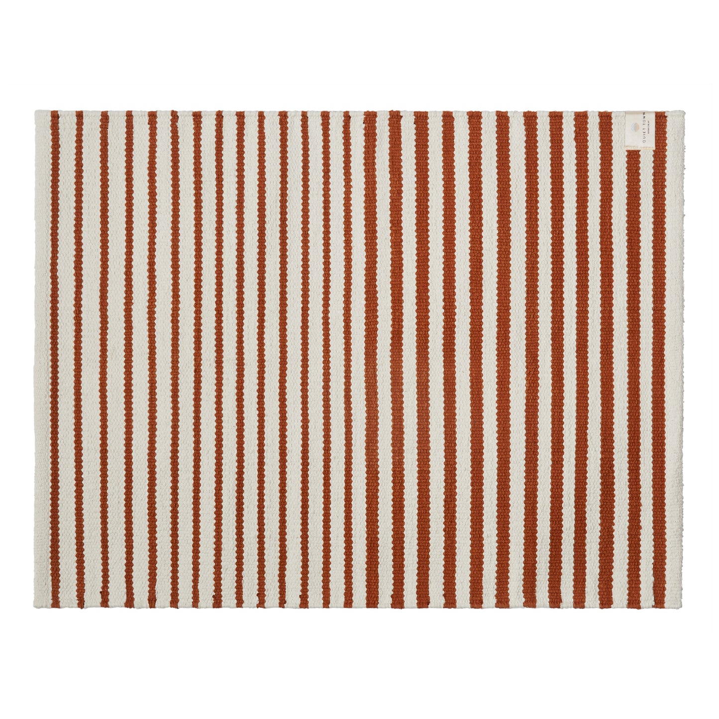Striped rug with brown and white vertical stripes on a white background