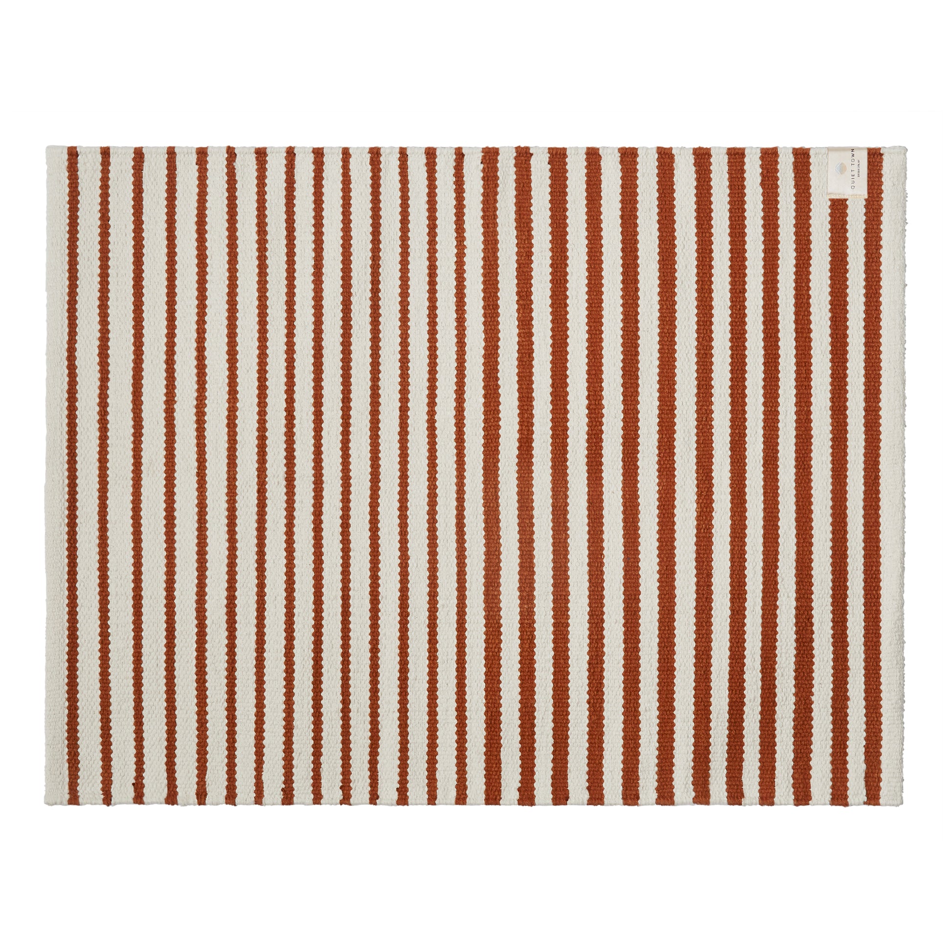 Striped rug with brown and white vertical stripes on a white background