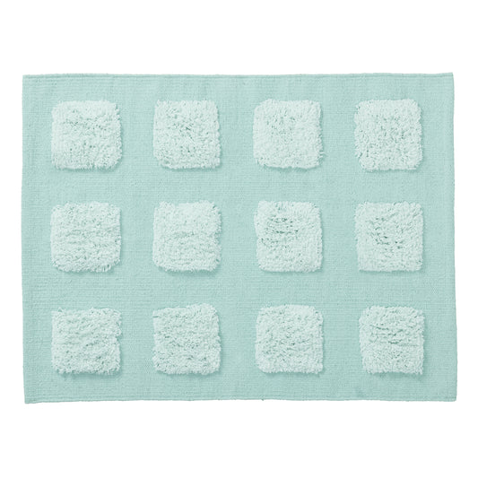 mint green textured bath rug on a white background. 