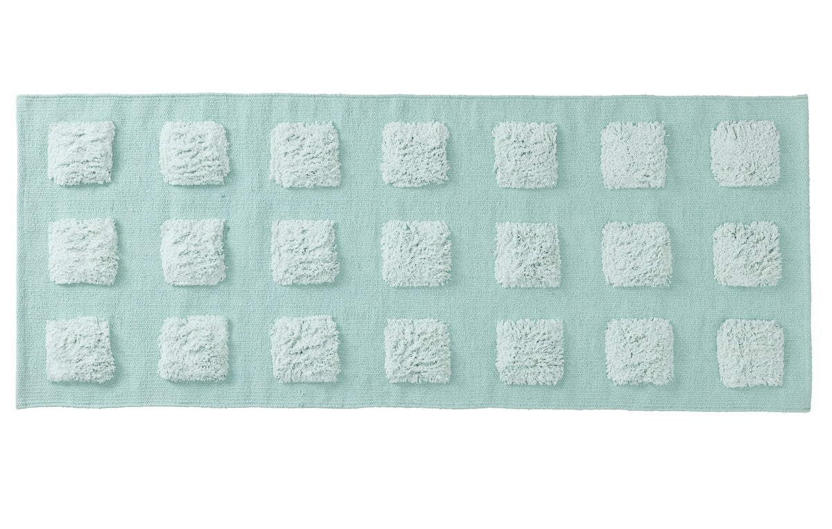 mint green textured rectangular bath rug on a white background. 
