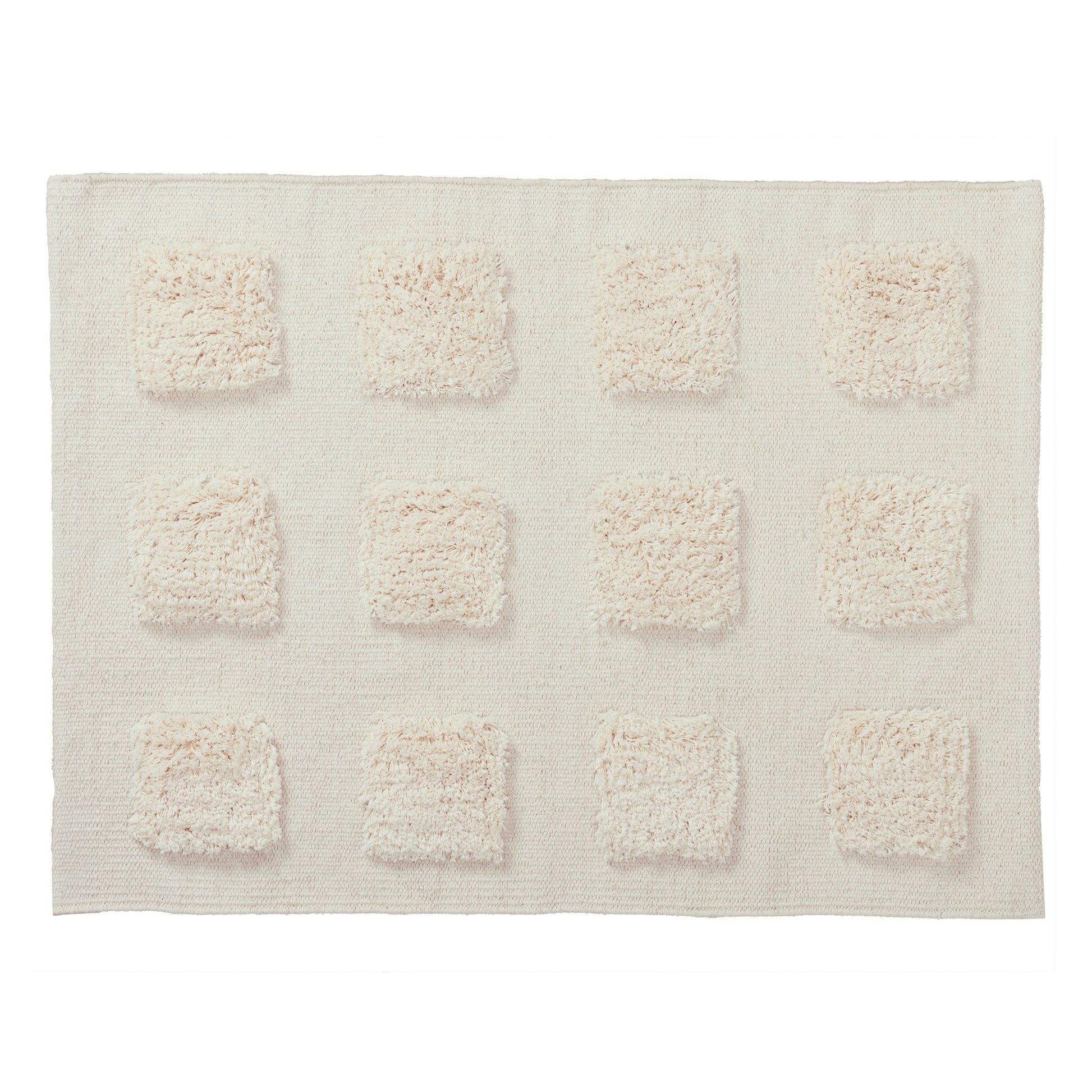 cream textured bath rug on a white background. 
