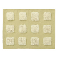 limey green textrued bath rug on a white background.
