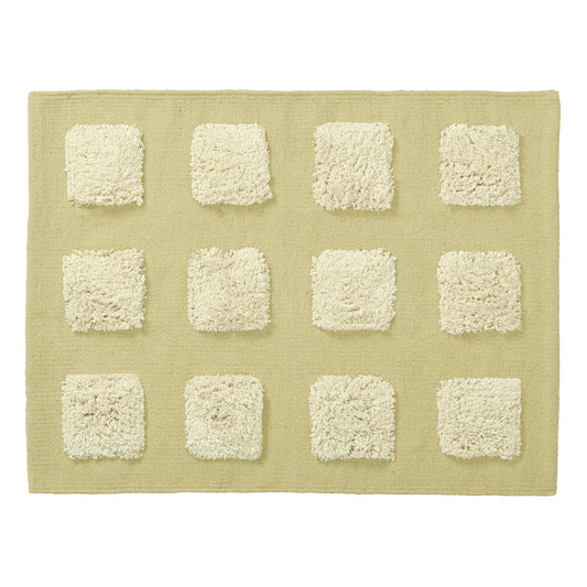 limey green textrued bath rug on a white background.