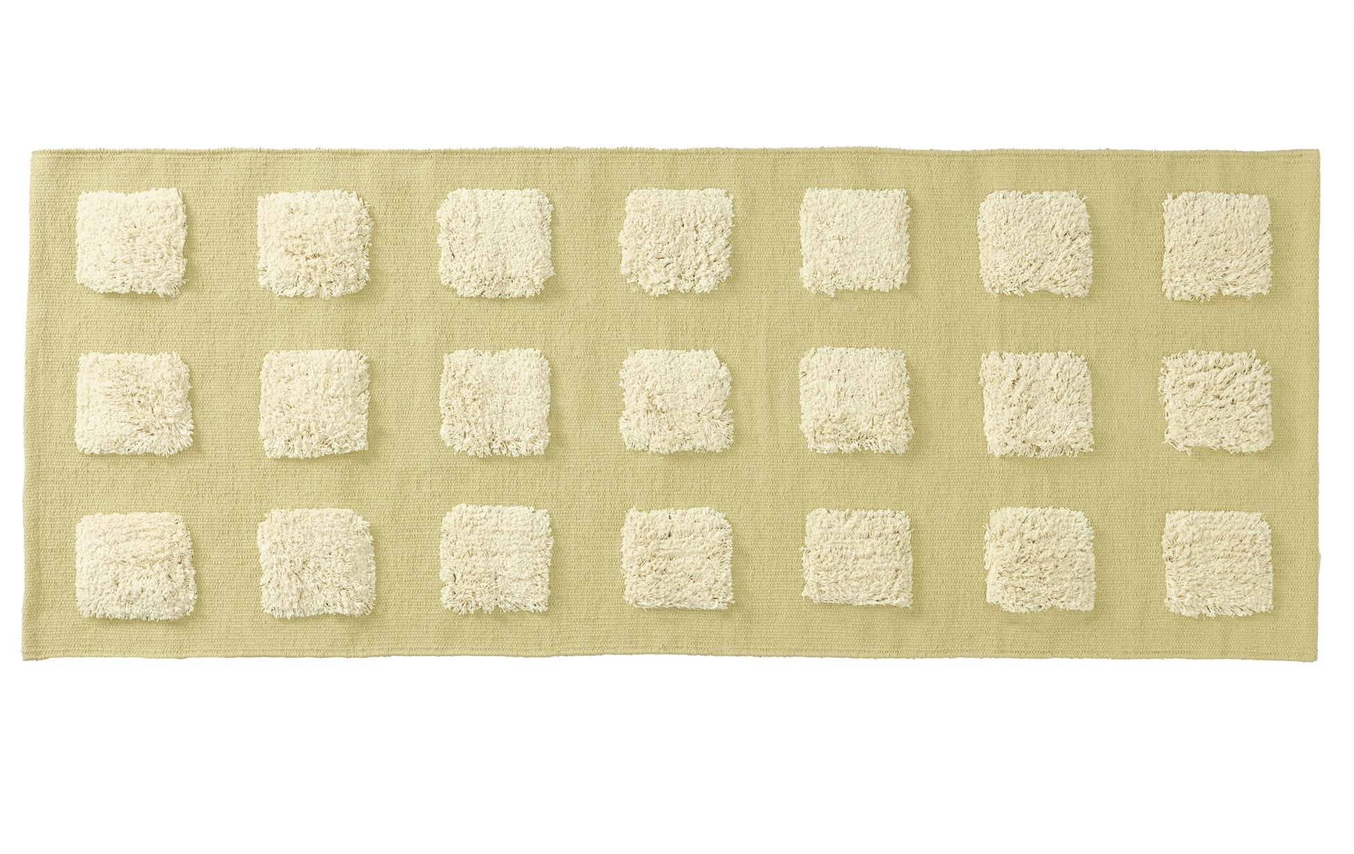 long rectangular limey green textured rug on a white backgrond. 