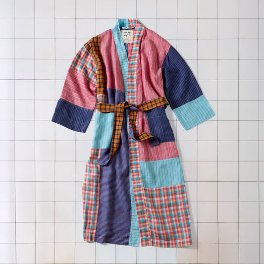 Colorful patchwork robe on a tiled floor