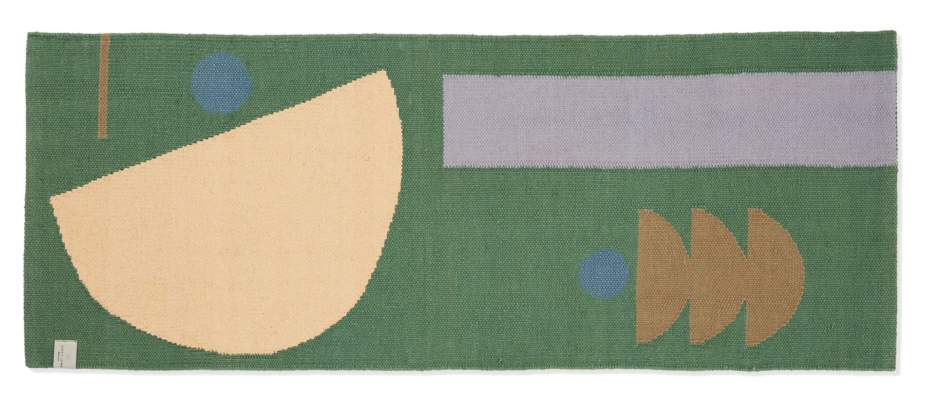 Green runner rug with organic shape pattern, shot against white backdrop.